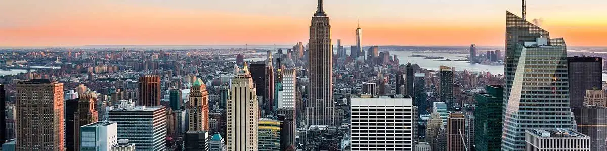 City skyline of high-rise commercial real estate at sunset